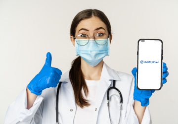 A-enthusiastic-physician-is-giving-a-thumbs-up-to-our-mobile-app-AvidOpinion-for-seamless-doctor-survey-completion